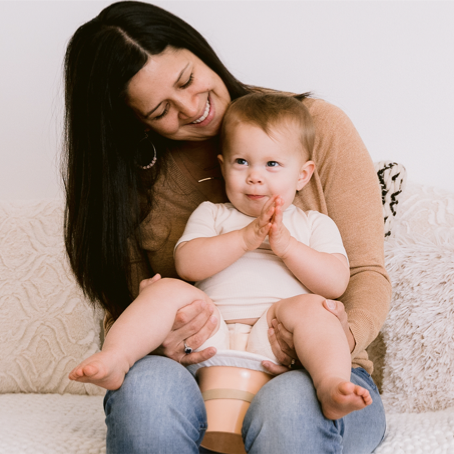 Andrea Olson with baby on top hat potty