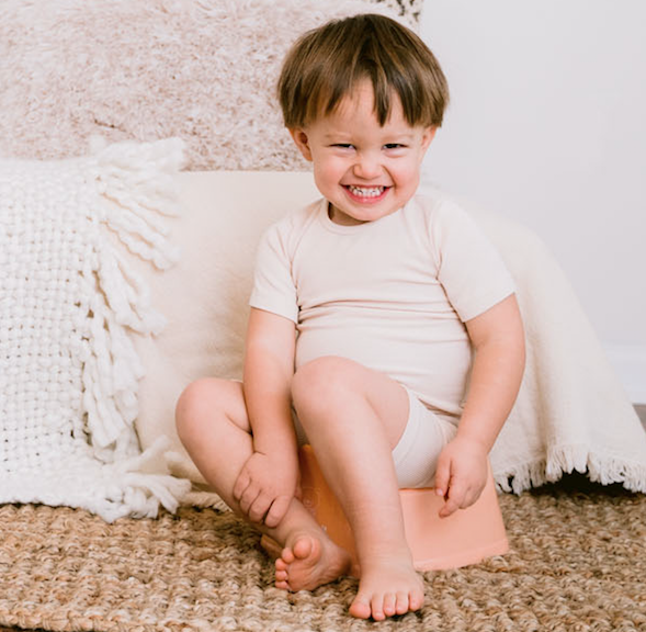 Andrea Olson with baby on top hat potty